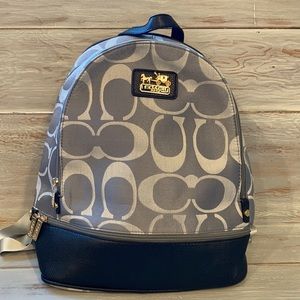 Coach* logo embroidered backpack.